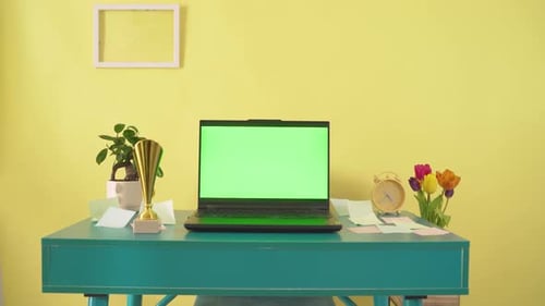 Laptop Green Screen Display Open on Yellow Background Mockup Empty Green Monitor for Video Call