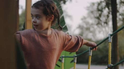 Little Girl Walking on Logs in the Playground Balancing Concept Closeup
