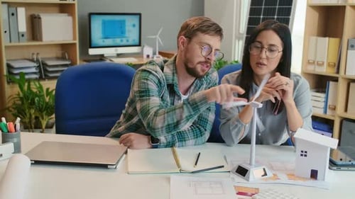 Team Discussing Renewable Energy Solutions in Office