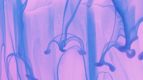 Abstract Swirling Blue Ink on Pink Background