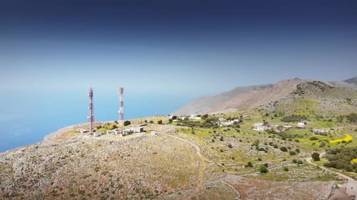 Island with communications tower on hill