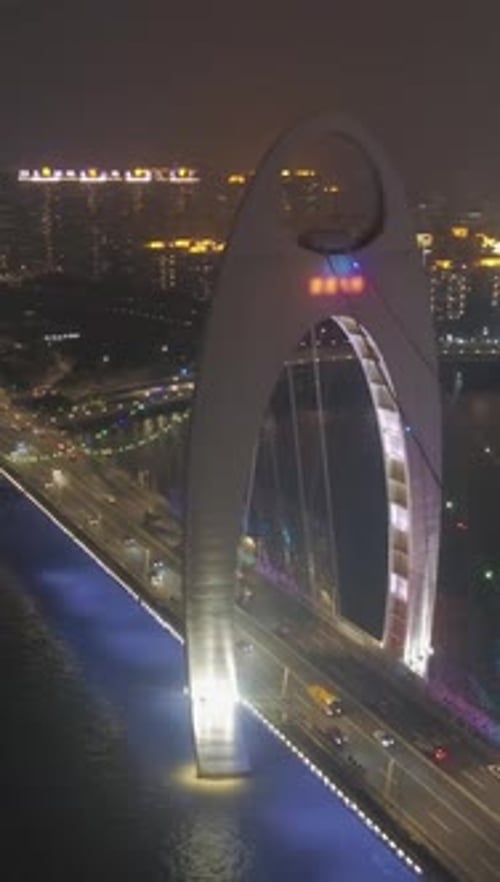 Liede Bridge on Pearl River at Night Guangzhou City China Aerial View Vertical Video