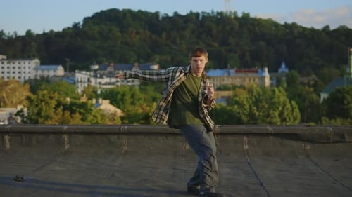 Caucasian Dancer Performing Hip Hop Outside on the Roof