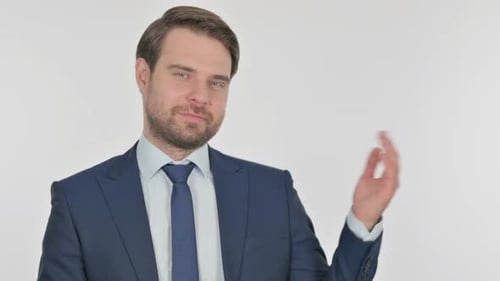 Young Businessman Showing on Side on White Background