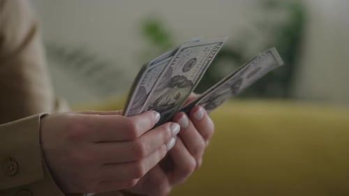 Hands Counting United States Currency Dollar Bills