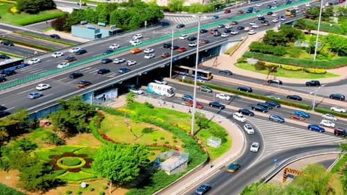Beautiful bird's eye of busy driving traffic highway on roundabout during rush hour interchange and