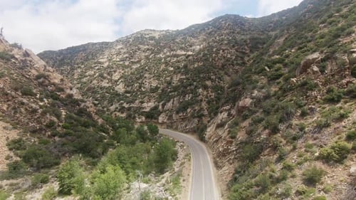 Drone footage flying over mountain range.