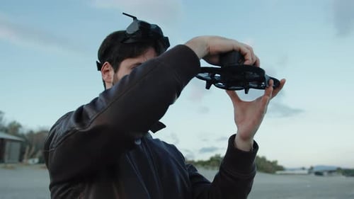 Man Fix and Check His Fpv Drone on the Beach