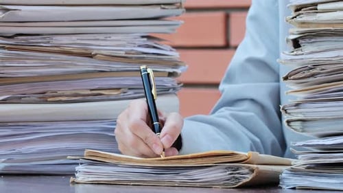 Business Concept. Young businesswoman putting signature on paper. Office worker in workplace