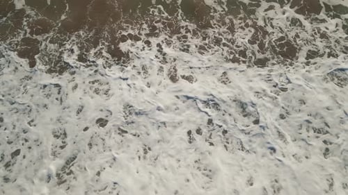 Fixed shot of ocean beach waves