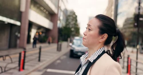Coffee, walking and Japanese business woman in the city crossing the road to work or job