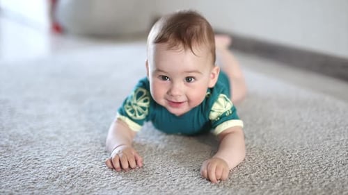 Smiling Infant Lying on Carpet