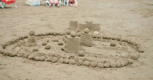 Close Up Of Simple Sand Castle Structure At The Beach In Summer.