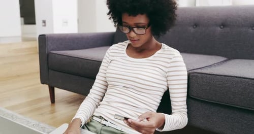 Woman Using Laptop and Credit Card on Floor