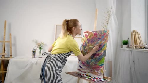 Joyful Woman Artist Drawing Abstract Picture in Art Studio Hobby and Profession Young Adult Inspired