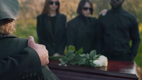 Mourners Gathered at Outdoor Funeral Service