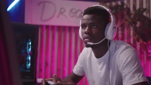 Young Adult Gaming with Controller at Night