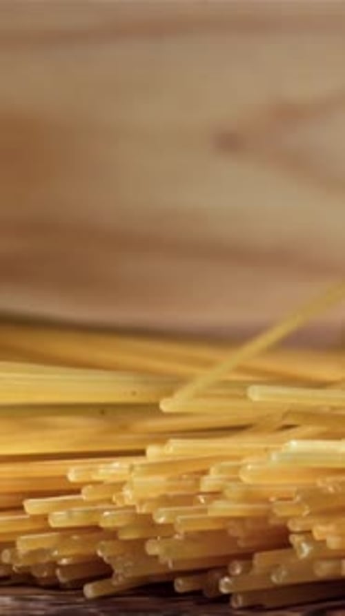 Spaghetti Falling on a Wooden Table Filmed on a Highspeed Camera at 1000 Fps