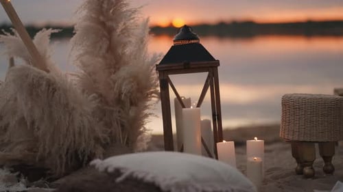 Retro And Vintage Style Decorations On Sandy Beach Of Lake In Sunset Romantic Date Or Wedding