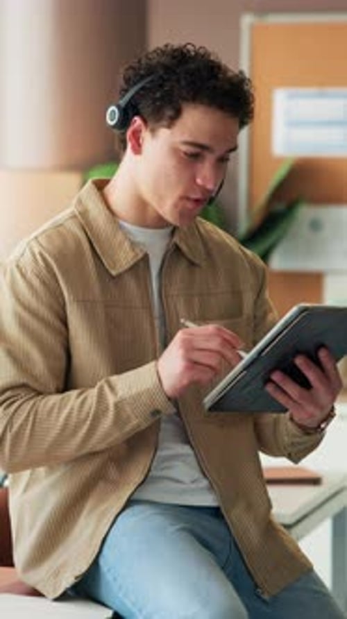 Headset, creative and man in office on tablet for seo report, online consultant and website review