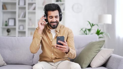 Man Listening Music and Dancing with Smartphone