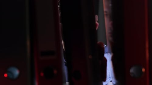 Office Worker Searching Files in Archive at Night Archive Information