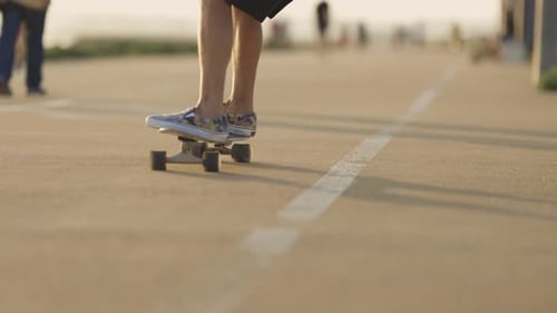 Adult Man Skating on Skateboard on the Street