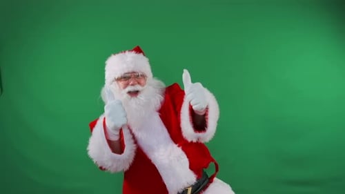 Santa Gives a Thumbs Up on a Green Screen Perfect for Branding Mockups