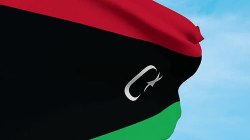 Realistic Waving Flag of Libya Animation Against Blue Sky