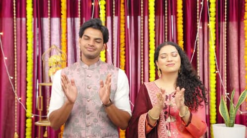Young Adults Praying and Clapping for Devotion