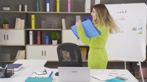 Smiling Woman Working at Office Desk