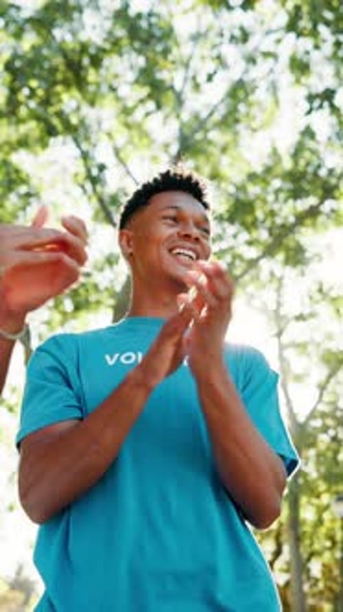 Teamwork, volunteer and people with applause in park for charity event, community service and help