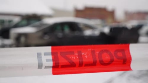 Vandalised car arson police crime scene, on snowy winter city street, German police