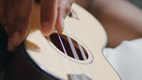 Man Hands Playing Ukulele Indoors Vertical Unknown Musician Touching Strings