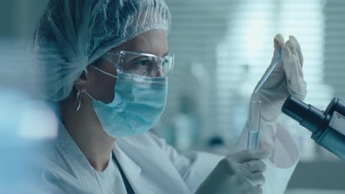 Close Up Lab Work with Test Tubes and Pipette