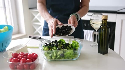 Preparing a Fresh and Healthy Salad in Kitchen