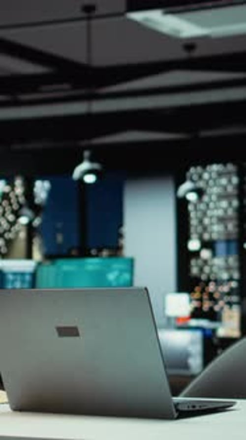 Vertical Video Empty Corporate Boardroom at Night Glows with Digital Displays