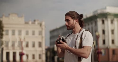 Young Adult Photographer Takes Photos in City
