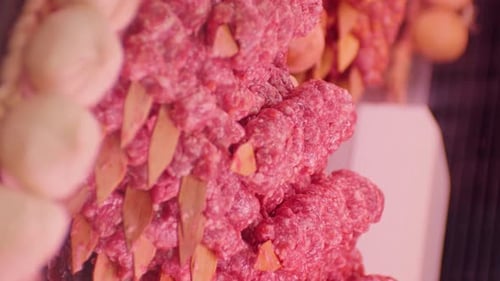 Rows of Fresh Raw Ground Meat Kebabs Close-Up