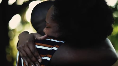 Affectionate Couple Embracing Tenderly in Golden Sunlight