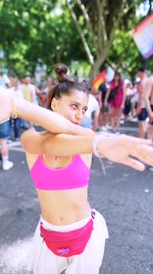A Joyful Celebration Occurs at the Pride Parade with Colorful Attire and Energetic Dance