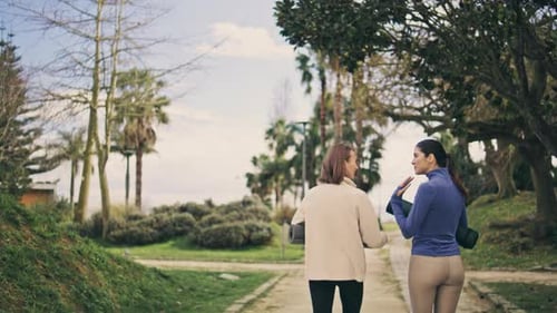 Yoga Friends Talking in Spring Park Alley