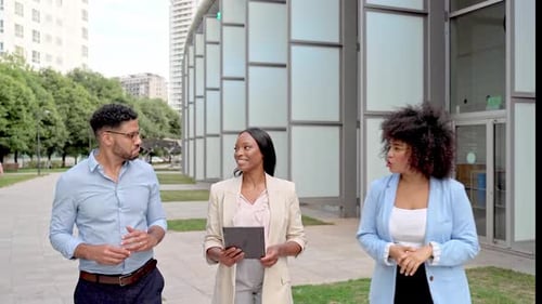Video of International business people walking at outdoor discussing plans and work project