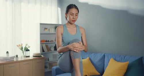 Woman Stretching her Legs for Exercise at Home