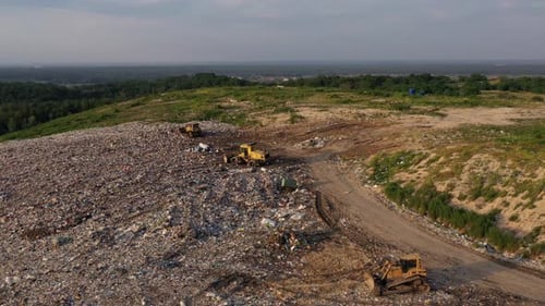 Top View of Bulldozers on the Garbage Dump Field