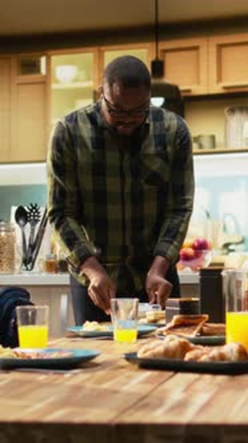 Vertical Video Father Packing School Lunch for His Young Son and Preparing His Backpack