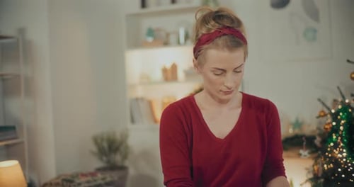 Woman Preparing Christmas Wreath Garland For Christmas Holidays