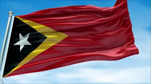 East Timor Flag Raised and Waving Against the Sky View