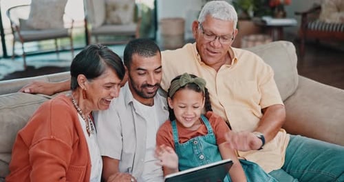 Happy Family Enjoying Tablet Technology at Home Together