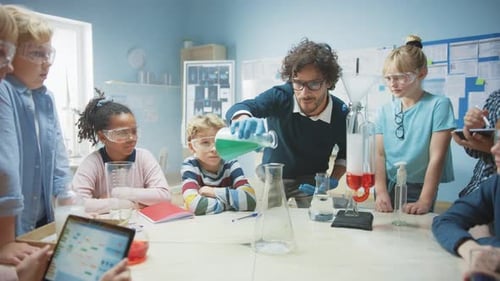 Elementary School Science / Chemistry Classroom: Enthusiastic Teacher Shows Funny Chemical Reaction